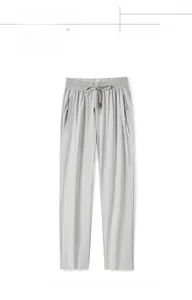 Light gray quick-dry sports pants with elastic drawstring waist and zippered pockets