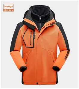 Detail of orange 3-in-1 waterproof jacket showing fleece liner and adjustable cuffs