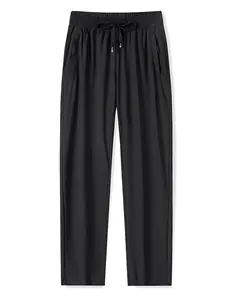 Pantalon homme en soie glacée noire à cordon de serrage avec poches zippées à plat