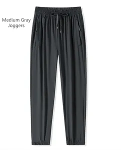 Détail du jogging gris moyen avec taille élastique et poches zippées pratiques