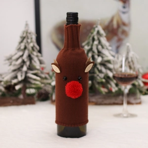 Knitted reindeer wine bottle cover with red nose for Christmas table decoration