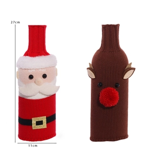 Detail of Santa and Reindeer knitted wine bottle covers with 27cm by 11cm dimensions