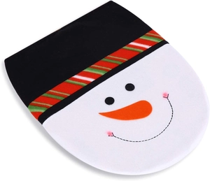 Close-up of plush snowman toilet seat cover with festive carrot nose and striped hat decor