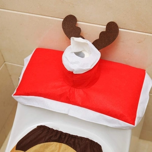Detailed view of festive reindeer toilet tank cover and red tissue box holder decoration