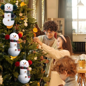 Three plush snowman Christmas tree hanging ornaments with plaid scarves and ear muffs
