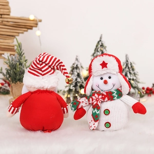 Detailed knit Christmas gift bags featuring snowman motifs and festive red-green scarves