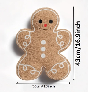 Detail view showing gingerbread man plush pillow dimensions of 43cm height and 33cm width