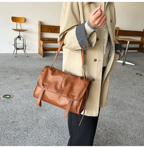Brown vintage faux leather shoulder bag featuring adjustable strap and buckle flap detail