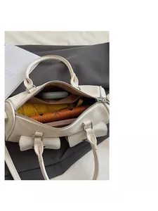 Interior view of off-white Boston bag showing spacious capacity for phone and umbrella