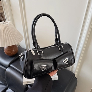 Detail of black cylindrical handbag showing silver Gancini buckles and leather texture
