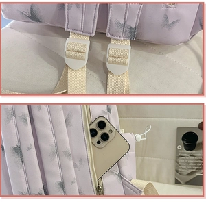 Détail du sac à dos scolaire en nylon violet avec motif papillon et sangles réglables