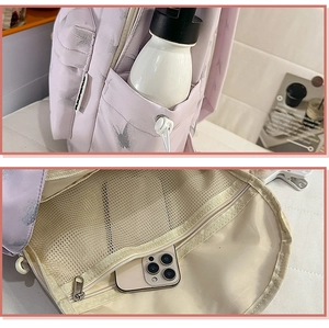 Détails du sac à dos lavande à motifs papillons avec poches latérales et filet interne