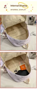 Vue intérieure du sac à dos en nylon mauve avec poches de rangement et filet zippé