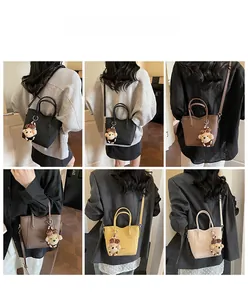 Detail view of mini bucket bags in four colors with cute plush bear charms on models