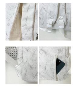 Detail of marble pattern backpack featuring breathable mesh padding and anti-theft back pocket