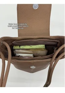 Internal view of brown leather pumpkin bag showing spacious capacity and secure compartments