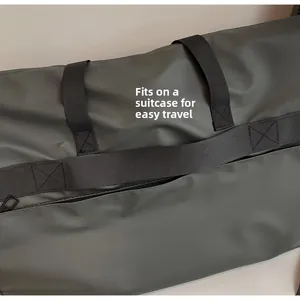 Detail of grey tote bag with trolley sleeve and back zipper pocket for easy travel