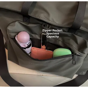 Close-up of front zipper pocket showing large capacity for umbrella and small essentials