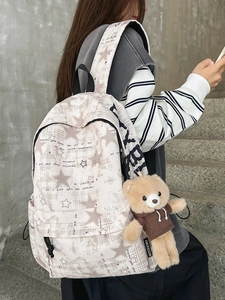 Minimalist canvas student backpack with star patterns and a cute bear keychain charm