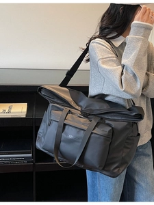 Minimalist black versatile lightweight tote bag for women shown with model