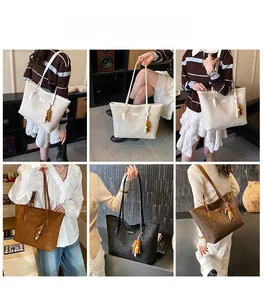 Detailed views of large faux leather tote bags in cream, brown, and black with beaded charms