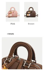 Vue détaillée du mini sac Boston rose et marron avec poignées en cuir et fermetures éclair