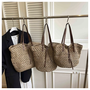 Detailed view of woven straw tote bags with brown PU handles in various hollow designs