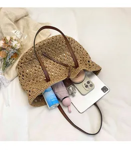 Detail view of woven straw tote bag interior showing large capacity for essentials