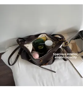 Macro view of spacious leather tote interior showing multiple pockets and storage capacity