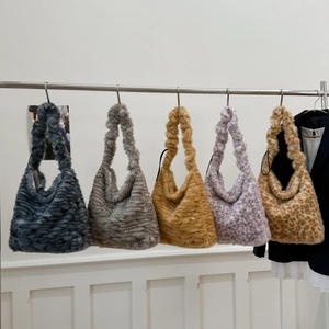Macro display of five different leopard print and solid faux fur tote bag color options
