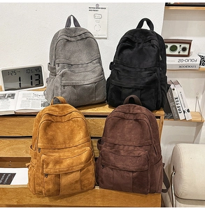 Detail view of retro corduroy backpacks in four colors for school or daily use