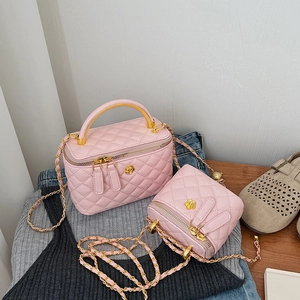 Pink quilted leather mini box bag set with gold rose hardware and chain strap
