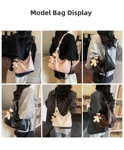 Detail display of large capacity tote bag with knot strap and plush bear pendant detail