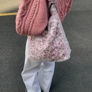 Detail of pink and grey leopard print faux fur tote bag showing soft texture