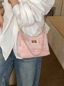 Pink printed half-moon crossbody bag with golden chain strap and leather patchwork