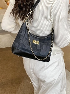 Vintage dark denim dumpling bag with gold chain and crossbody strap for women