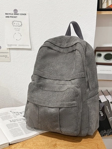 Grey multi-pocket canvas backpack for students with a minimalist workwear design
