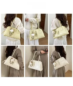 Detailed views of stylish beige and white shoulder bags with cute plush doll charms