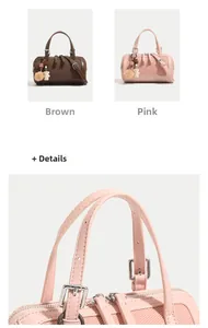 Detail of Boston bag with woven texture, silver hardware and plush bear pendant accessory