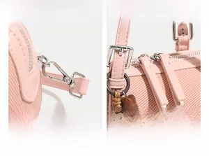 Detail of pink Boston bag showing silver hardware and brown star plush charm attachment