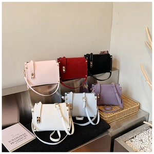 Collection of minimalist rectangular crossbody bags in six assorted pastel colors on display