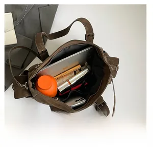 Top view of spacious brown vintage tote bag showing interior storage for laptop and essentials