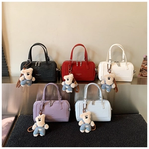 Selection of five mini pillow bags in various colors with cute plush bear charms