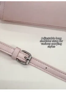 Detail of adjustable leather shoulder strap with silver buckle for versatile carrying options