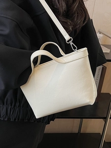 Chic beige large capacity tote bag with dual straps and polished PU leather texture