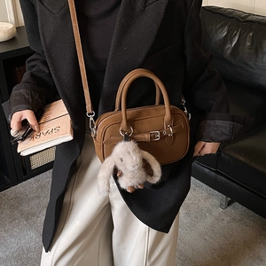 Vintage brown leather crossbody bag with cute rabbit pendant and decorative metal buckle