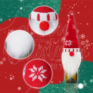 Detail of Christmas wine bottle cover with snowflake knit hat and plush gnome beard