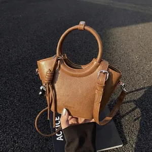 Women's PU Leather Bucket Bag Minimalist Circular Handle Shoulder Crossbody Bag With Metallic Heart Pendant Small Handbag For Daily