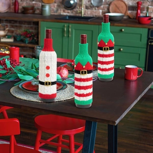 Three-piece knitted Christmas wine bottle covers with Santa and Elf festive designs