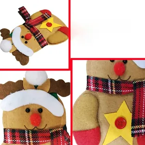Detail view of felt Christmas reindeer cutlery holder with festive red plaid scarf